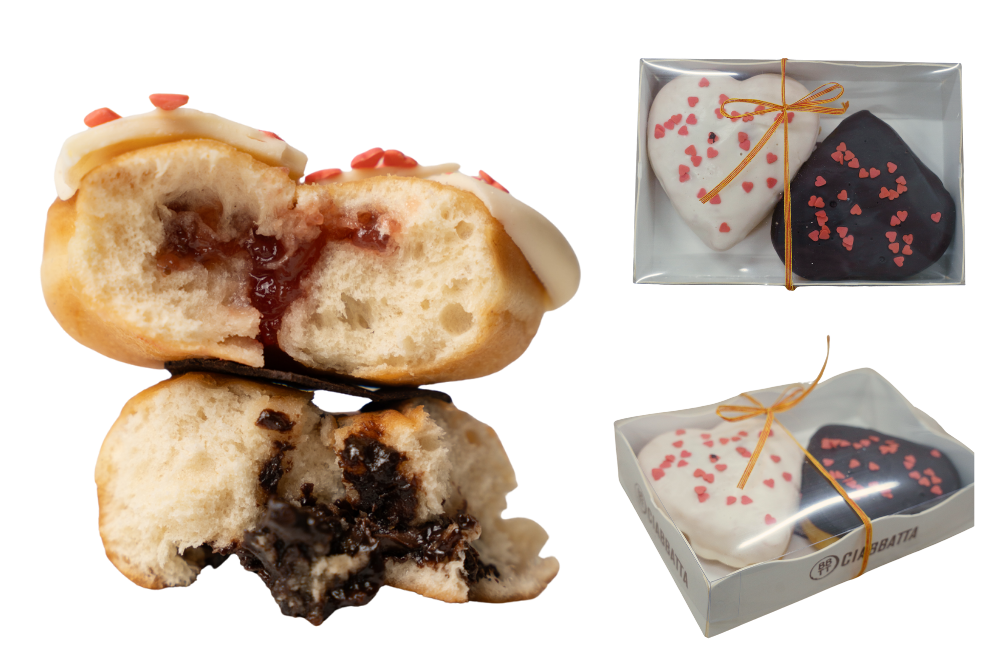 Caixa rectangular amb dues berlines en forma de cor. Una de xocolata negre i l'altre de xocolata blanca i maduixa.